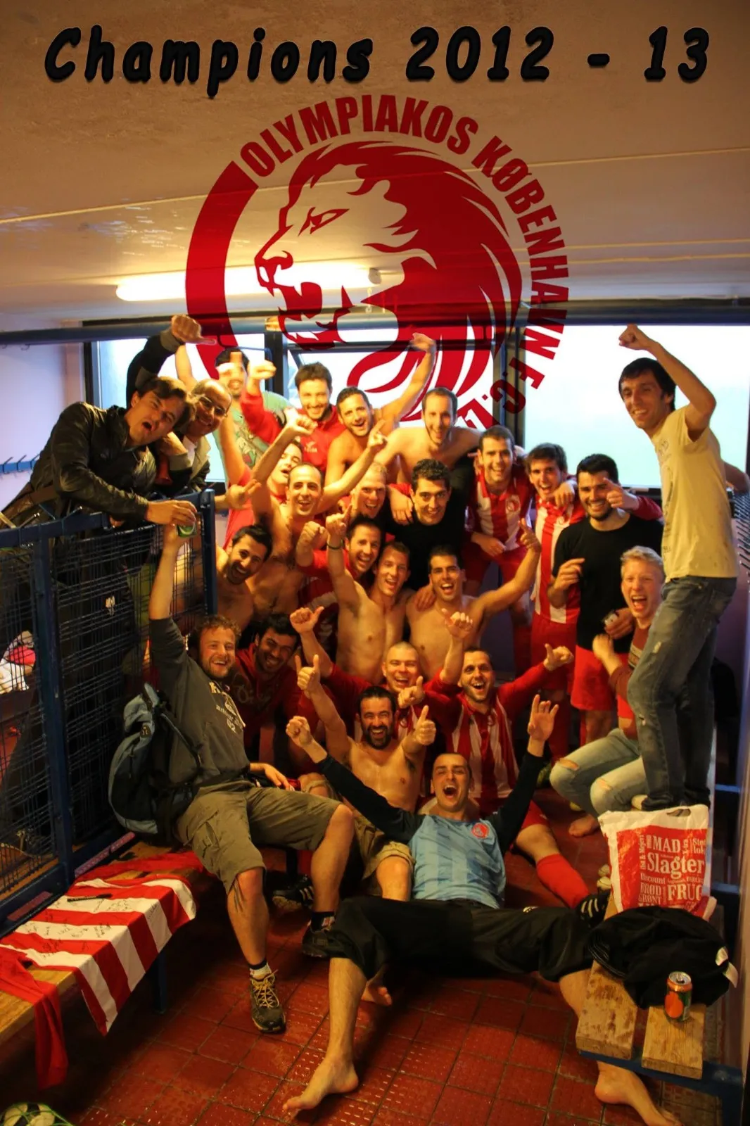 The team celebrates in the changing room with arms in the air, under the words Champions 2012-13